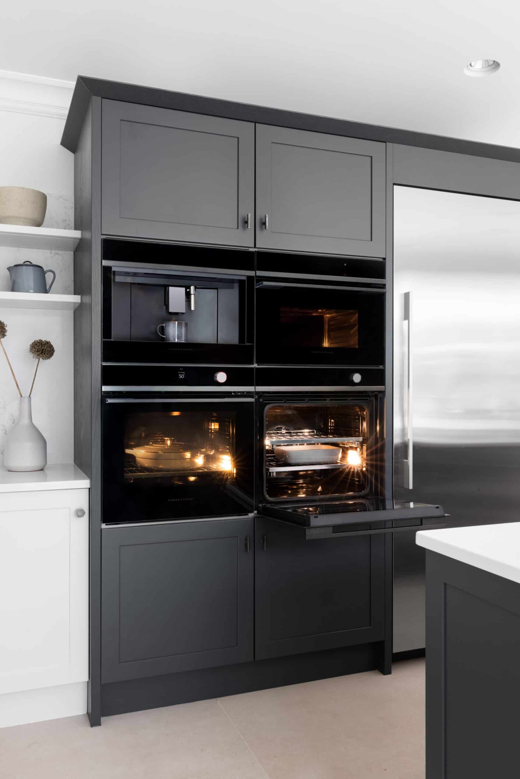 Double built in ovens in black kitchen cabinets